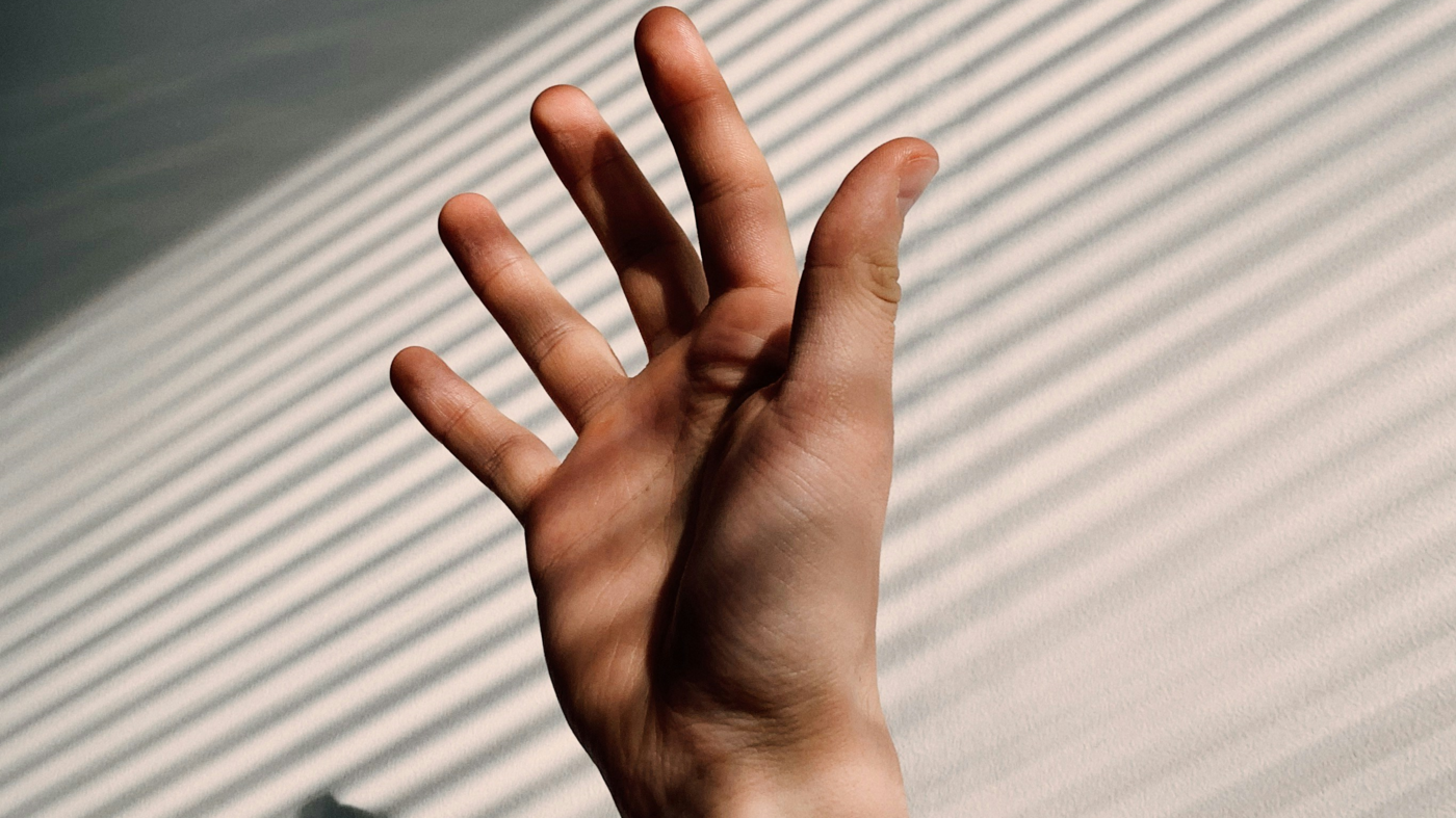 Hand - Photo by Mika Korhonen on Unsplash