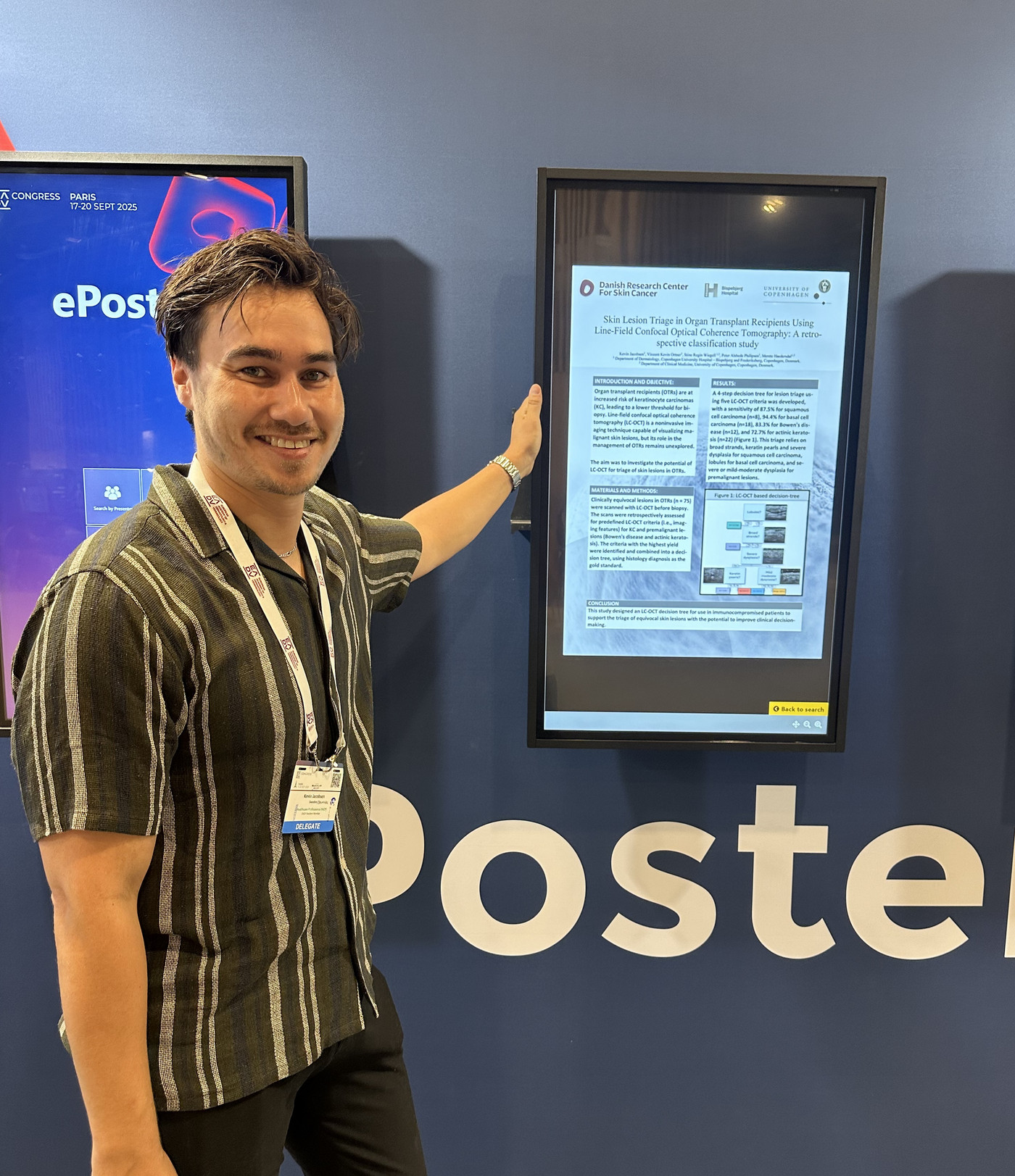 Kevin Jacobsen with poster information 